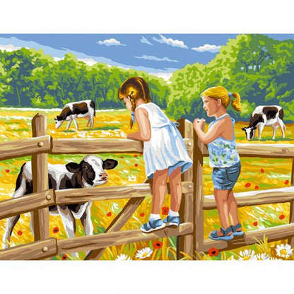 Le bambine sul recinto e le mucche