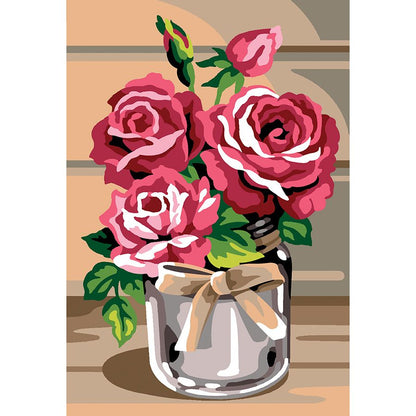 Vaso di fiori con le rose rosa