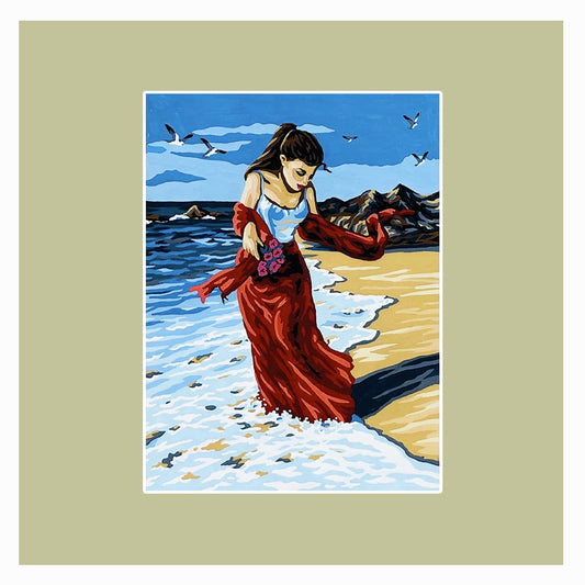 Donna con abito rosso in spiaggia