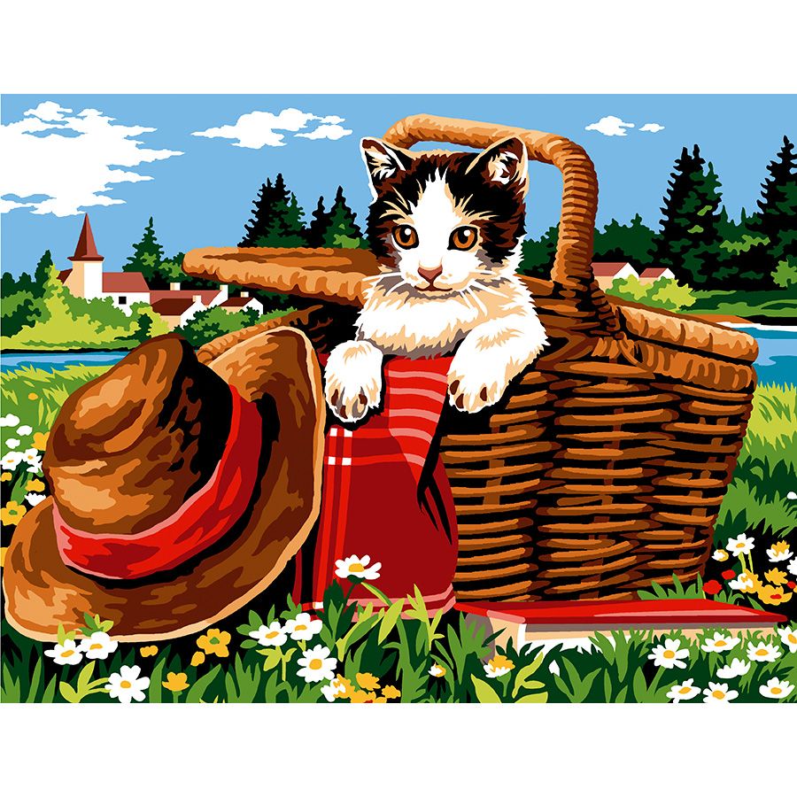 Gatto nel cesto da picnic