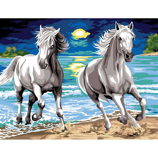 I cavalli sulla spiaggia al tramonto