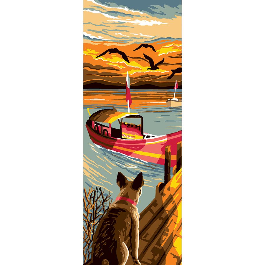 Il cane sul molo al tramonto