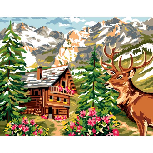 Il cervo e lo chalet tra le montagne