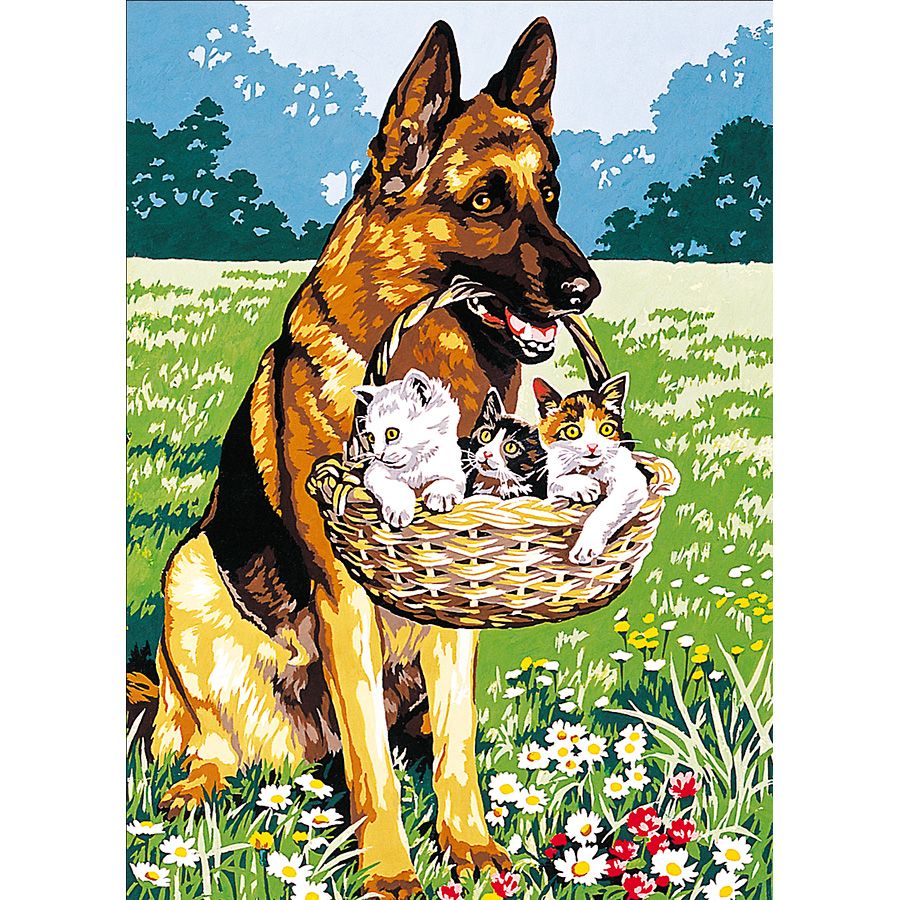 Pastore tedesco con i gattini nel cestino