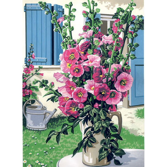 Vaso di fiori rosa nel giardino