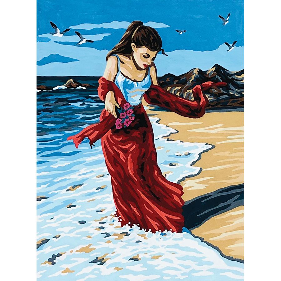 Donna con abito rosso in spiaggia